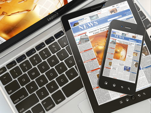 Notebook, celular e tablet mostrando a criação de sites responsivos